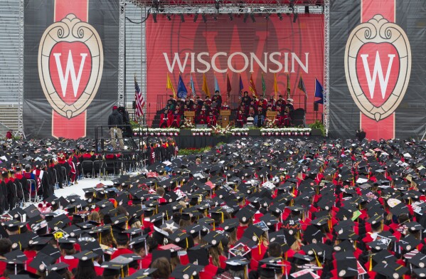 FILE - The commencement address is given during graduation at the University of Wisconsin in Madison, Wis., on May 12, 2018. A state Senate committee is recommending the full chamber fire two Universities of Wisconsin regents who voted Thursday, March 7, 2024, against a deal that called for limiting campus diversity positions in exchange for state funding. (AP Photo/Jon Elswick, File)