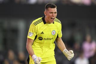 FILE - Chicago Fire's Gabriel Slonina (1) yells after making a save during an MLS soccer match, Saturday, Feb. 26, 2022, in Fort Lauderdale. Fla. Chicago Fire's Gabriel Slonina, an 18-year-old viewed as a goalkeeper of the future for the U.S. national team, was listed on Poland's 39-man roster announced by coach Czesław Michniewicz on Tuesday, May 17, 2022, ahead of four Nations League matches next month.(AP Photo/Doug Murray, File)