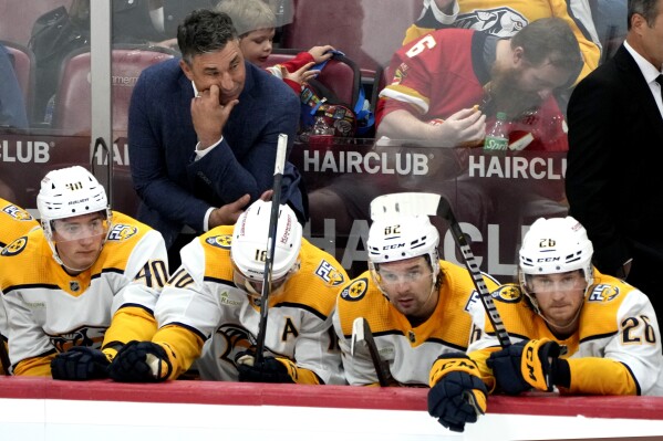 Nashville Predators head coach Andrew Brunette, top left, looks on during the third period of a preseason NHL hockey game against the Florida Panthers, Monday, Sept. 25, 2023, in Sunrise, Fla. (AP Photo/Lynne Sladky)