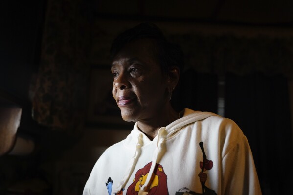 Angela Adams watches her kitchen sink fill with water in her home of 30 years on Tuesday, Dec. 5, 2023, in Alabama Village, the Prichard, Ala., neighborhood where almost one-fifth of the city’s water loss occurs. There is talk of seizing residents' property and paying them to move to help stem the city's water loss and create opportunities for redevelopment. 