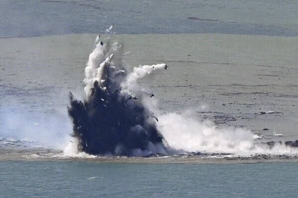 In this aerial photo, plume billows out from the water off the Ioto island, following an eruption in Ogasawara, southern Tokyo, Japan, on Oct. 30, 2023. An unnamed undersea volcano, located about 1 kilometer (half a mile) off the southern coast of Iwo Jima, which Japan calls Ioto, started its latest series of eruptions on Oct. 21. (Kyodo News via AP)