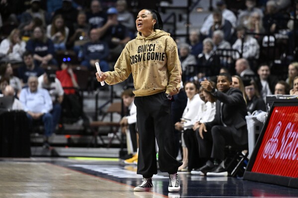South Carolina head coach Dawn Staley calls out to an official in the first half of an NCAA college basketball game against Utah, Sunday, Dec. 10, 2023, in Uncasville, Conn. (AP Photo/Jessica Hill)