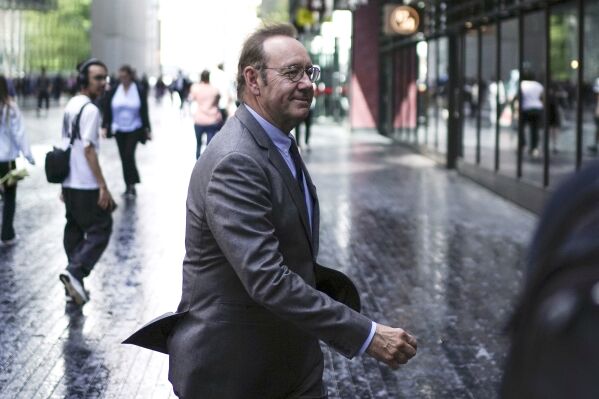 Actor Kevin Spacey walks outside Southwark Crown Court, London, Monday July 17, 2023. Elton John briefly testified Monday for the defense at Kevin Spacey's sexual assault trial as the actor's lawyer attempted to discredit a man who claimed the Oscar winner aggressively grabbed his crotch while driving to the singer's summer ball. (Jordan Pettitt/PA via AP)