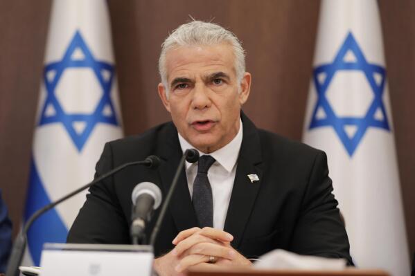 Israeli Prime Minister Yair Lapid speaks during a cabinet meeting at the prime minster's office in Jerusalem, Sunday, July 17, 2022. (Abir Sultan/Pool Photo via AP)