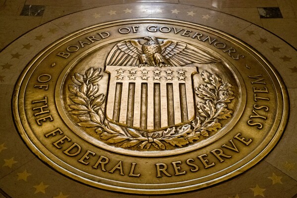 FILE- The seal of the Board of Governors of the United States Federal Reserve System is shown at the Marriner S. Eccles Federal Reserve Board Building in Washington on Feb. 5, 2018. (AP Photo/Andrew Harnik, File)