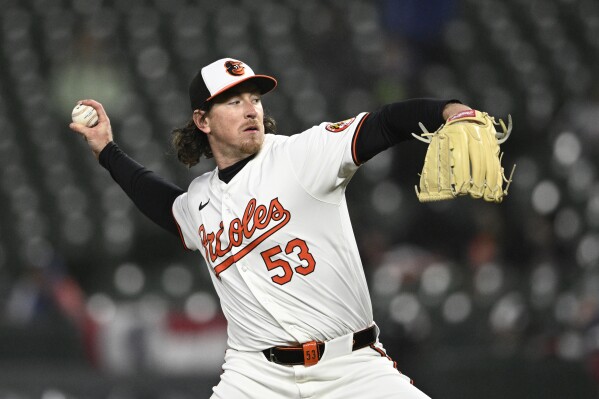 FILE - Baltimore Orioles relief pitcher Mike Baumann throws to a Kansas City Royals during a baseball game April 3, 2024, in Baltimore. Baumann and minor league catcher Michael Pérez were acquired by the Seattle Mariners from the Orioles on Wednesday, May 22, for catcher Blake Hunt. (AP Photo/Nick Wass, File)