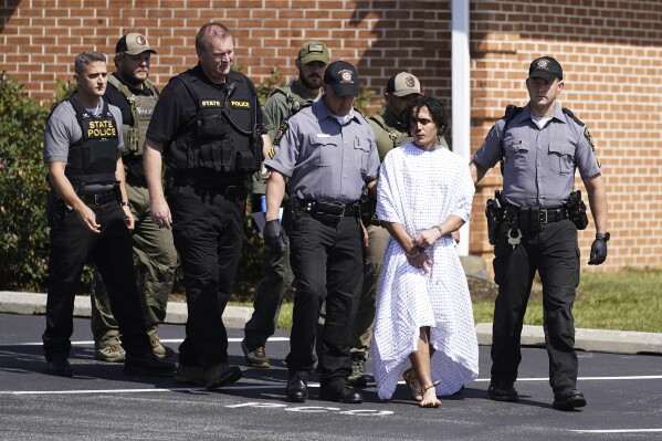 CORRECTS SPELLING OF FIRST NAME TO DANILO INSTEAD OF DANELO - Law enforcement officers escort Danilo Cavalcante from a Pennsylvania State Police barracks in Avondale Pa., Wednesday, Sept. 13, 2023. Cavalcante was captured Wednesday after eluding hundreds of searchers for two weeks. (AP Photo/Matt Rourke)