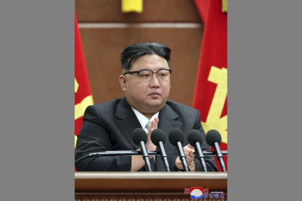 In this photo provided by the North Korean government, North Korean leader Kim Jong Un claps hands during a year-end plenary meeting of the ruling Workers' Party in Pyongyang, North Korea, Tuesday, Dec. 26, 2023. Kim praised what he called achievements and victories that strengthened national power and boosted the country's prestige this year, as he opened a key political meeting to set new policy goals for 2024, state media reported Wednesday. Independent journalists were not given access to cover the event depicted in this image distributed by the North Korean government. The content of this image is as provided and cannot be independently verified. Korean language watermark on image as provided by source reads: "KCNA" which is the abbreviation for Korean Central News Agency. (Korean Central News Agency/Korea News Service via AP)