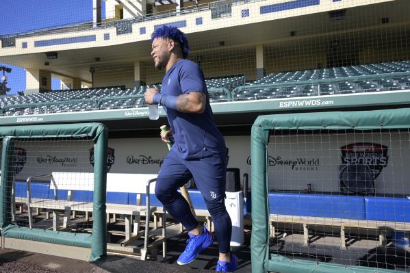 Tampa Bay Rays outfielder Harold Ramirez heads to the fields during the first practice for pitchers and catchers at spring training baseball camp, Wednesday, Feb. 15, 2023, in Kissimmee, Fla. (AP Photo/Phelan M. Ebenhack)