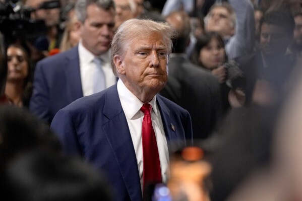 Republican presidential nominee former President Donald Trump speaks to reporters in the spin room after a presidential debate with Democratic presidential nominee Vice President Kamala Harris, Tuesday, Sept. 10, 2024, in Philadelphia. (AP Photo/Matt Slocum)