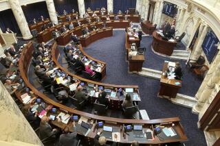 The Idaho House of Representative voted to approve a Texas-styled bill banning abortions after six weeks of pregnancy by allowing potential family members to sue a doctor who performs one, on Monday, March 14, 2022, at the Statehouse in Boise, Idaho. The bill has already passed the Senate and now heads to Republican Gov. Brad Little's desk. (AP Photo/Keith Ridler)