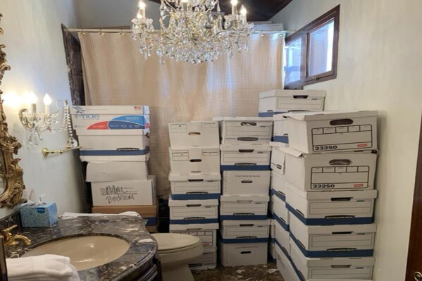 This image, contained in the indictment against former President Donald Trump, shows boxes of records stored in a bathroom and shower in the Lake Room at Trump's Mar-a-Lago estate in Palm Beach, Fla. The classified documents investigation of Donald Trump appeared to have clear momentum in 2022 when FBI agents who searched the former president’s Mar-a-Lago estate recovered dozens of boxes containing sensitive documents. But each passing day brings mounting doubts that the case can reach trial this year. The judge has yet to set a firm trial date despite holding two hours-long hearings with lawyers this month. (Justice Department via AP)