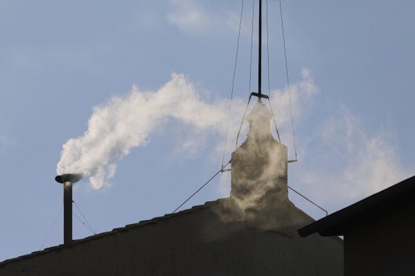 White smoke billows from the chimney of the Sistine Chapel where 133 cardinals are gathering on the second day of the conclave to elect a successor to late Pope Francis, at the Vatican, Thursday, May 8, 2025 (AP Photo/Alessandra Tarantino)