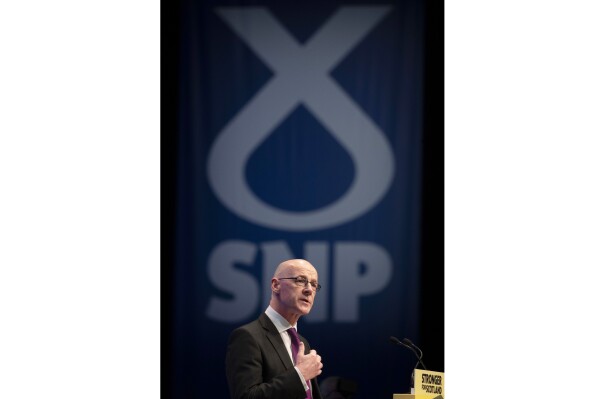 FILE - Deputy First Minister John Swinney delivers his address to delegates during the 2019 SNP autumn conference at the Event Complex in Aberdeen, Oct. 14. 2019. John Swinney was elected Monday, May 6, 2024 as leader of the SNP after no other candidates came forward. (Jane Barlow/PA via AP, File)