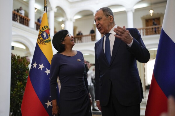 Russia's Foreign Minister Sergey Lavrov, right, speaks with Venezuelan Vice President Delcy Rodriguez at the Foreign Ministry before meeting with Venezuelan Foreign Minister Yvan Gil Pinto in Caracas, Venezuela, Tuesday, Feb 20, 2024. (AP Photo/Matias Delacroix)