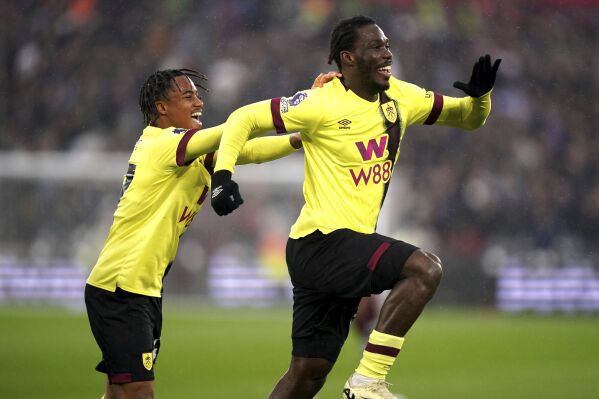 Burnley's David Datro Fofana, right, celebrates scoring their side's first goal of the game with team-mate during the English Premier League soccer match between Burnley FC and West Ham United at the London Stadium in London, Sunday March 10, 2024. (Bradley Collyer/PA via AP)