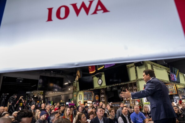 Republican presidential candidate Florida Gov. Ron DeSantis speaks at a rally at McDivot's Indoor Sports Pub in Grimes, Iowa, Sunday, Jan. 7, 2024. (AP Photo/Andrew Harnik)