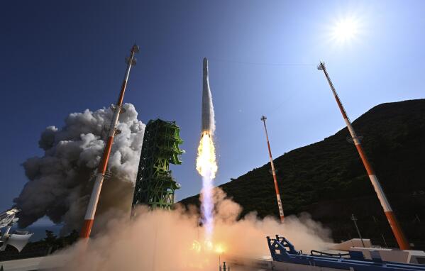 The Nuri rocket, the first domestically produced space rocket, lifts off from a launch pad at the Naro Space Center in Goheung, South Korea, Tuesday, June 21, 2022. South Korea successfully launched its first homegrown space rocket on Tuesday, officials said, a triumph that boosted the country's growing space ambitions but also proved it has key technologies to build a space-based surveillance system and bigger missiles amid animosities with rival North Korea. (Korea Pool/Yonhap via AP)