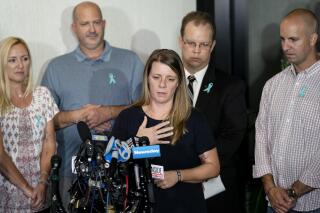 FILE - Nichole Schmidt, mother of Gabby Petito, whose death on a cross-country trip has sparked a manhunt for her boyfriend Brian Laundrie, speaks alongside, from left, Tara Petito, stepmother, Joseph Petito, father, Richard Stafford, family attorney, and Jim Schmidt, stepfather, during a news conference, Tuesday, Sept. 28, 2021, in Bohemia, N.Y. A Florida judge has refused to dismiss a lawsuit, Friday, July 1, 2022,  in which the parents of Gabby Petito claim that Brian Laundrie told his parents he had killed her before he returned home alone from their western trip. (AP Photo/John Minchillo, File)