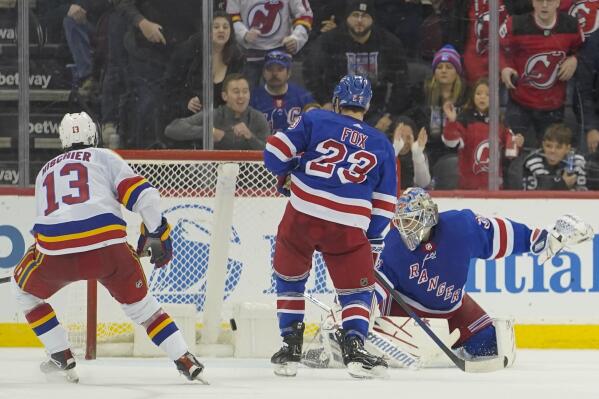New York Rangers goaltender Igor Shesterkin (31) watches as a shot by New Jersey Devils' defenseman Damon Severson, not shown, gets past him for the game- winning goal in overtime of an NHL hockey game, Saturday, Jan. 7, 2023, in Newark, N.J. The Devils won 4-3 in overtime. (AP Photo/Mary Altaffer)