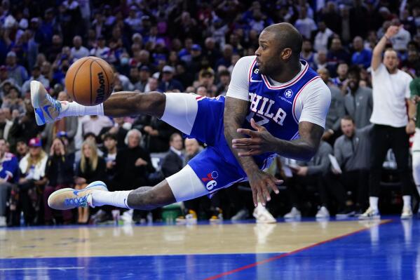 Philadelphia 76ers' P.J. Tucker saves a ball from going out of bounds during the second half of an NBA basketball game against the Milwaukee Bucks, Thursday, Oct. 20, 2022, in Philadelphia. (AP Photo/Matt Slocum)