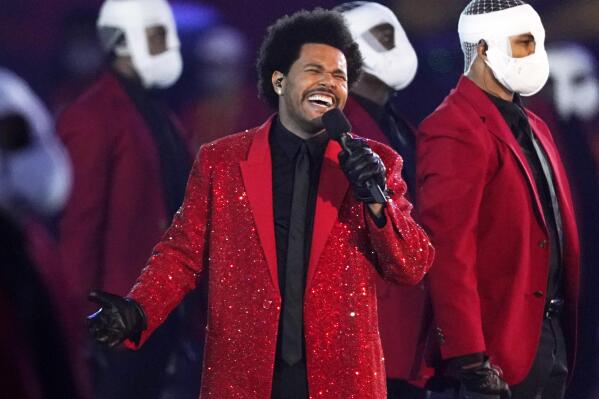 FILE - The Weeknd performs during the halftime show of the NFL Super Bowl 55 football game between the Kansas City Chiefs and Tampa Bay Buccaneers, on Feb. 7, 2021, in Tampa, Fla. The Weeknd, along with Swedish House Mafia, will replace rapper Ye, who changed his name from Kanye West, in a headlining spot at Coachella Valley Music and Arts Festival.  (AP Photo/Ashley Landis, File)