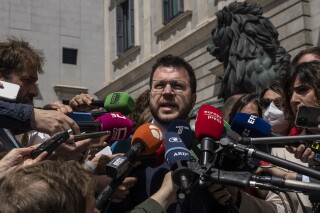 FILE - Catalan President Pere Aragones addresses the media in front of the Spanish Parliament in Madrid, Spain, Thursday, April 21, 2022. The leader of Spain's Catalonia called a snap election for May on Wednesday, March 13, 2024 after his minority government failed to pass a budget for the wealthy northeast region surrounding Barcelona. The election will be held on May 12. (AP Photo/Manu Fernandez, File)