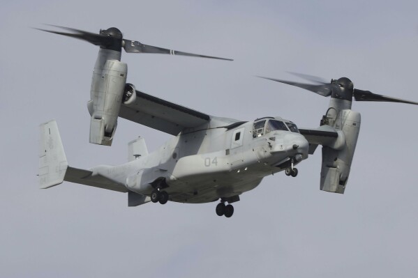 A U.S. MV-22 Osprey aircraft flies around the U.S. Marine Corps Air Station Futenma in Ginowan, Okinawa, southern Japan Thursday, March 14, 2024. The U.S. and Japanese militaries resumed flights of Osprey aircraft in Japan. (Kyodo News via AP)