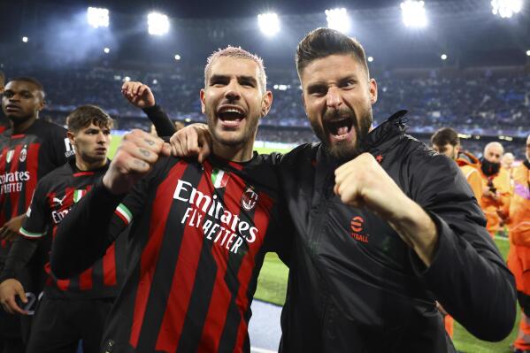 AC Milan's Olivier Giroud, right, and Theo Hernandez celebrate at the end of the Champions League quarterfinal second leg soccer match between Napoli and AC Milan, at Naples' Diego Armando Maradona stadium, Tuesday April 18, 2023. The match ended in a 1-1 draw and AC Milan advanced to the semifinal on a 1-2 aggregate. (Alessandro Garofalo/LaPresse via AP)