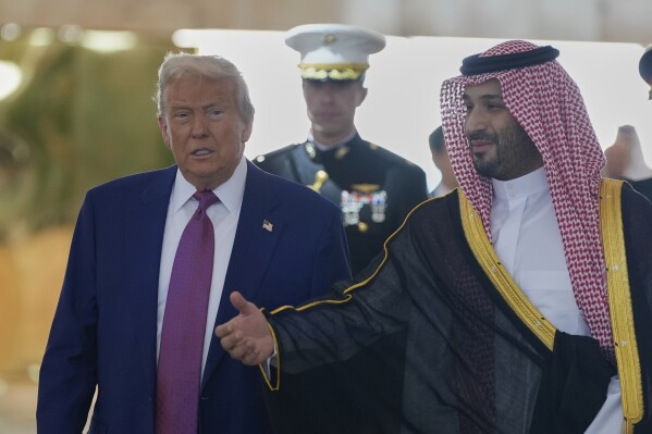 Saudi Crown Prince Mohammed bin Salman welcomes President Donald Trump during an arrival ceremony at the Royal Terminal of King Khalid International Airport in Riyadh, Saudi Arabia, Tuesday, May 13, 2025.(AP Photo/Alex Brandon)