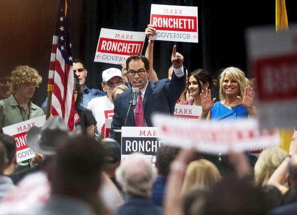 FILE - Republican Mark Ronchetti addresses the crowd with his wife and two daughters after winning the Republican primary for governor of New Mexico, during an election party in northeast Albuquerque, N.M., June 7, 2022. Ronchetti is campaigning on a law-and-order platform with proposals for annual tax rebates tied to oilfield production and a referendum that could ban abortion with limited exceptions. (Chancey Bush/The Albuquerque Journal via AP, File)