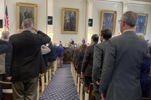 FILE - Members of the New Hampshire House recite the Pledge of Allegiance on March 10, 2022, in Concord, N.H. Unofficial results from the House clerk show an almost even partisan divide in the 400-member House after elections on Tuesday, Nov. 8, with 203 Republican winners and 197 Democrats. The Associated Press has not called many of the races, and recounts are likely. (AP Photo/Holly Ramer, File)