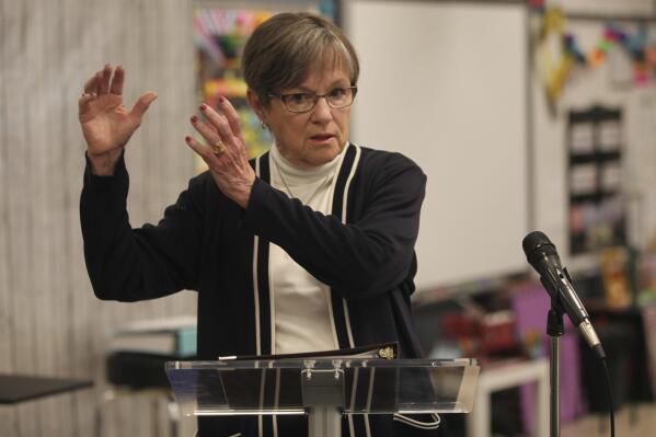 Kansas Gov. Laura Kelly answers questions from reporters during a news conference, Monday, April 24, 2023, in a second-grade classroom at Elmont Elementary School in Topeka, Kan. (AP Photo/John Hanna)