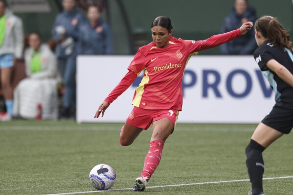FILE - Portland Thorns FC forward Sophia Smith (9) controls the ball during an NWSL soccer match against NJ/NY Gotham FC, Sunday, March 24, 2024, in Portland, Ore. Sophia Smith had options but in the end felt like she “wasn't done” in Portland. The Thorns announced Wednesday, March 27, that they have signed Smith to a contract extension through 2025, with a player option for 2026. (AP Photo/Amanda Loman, FIle)