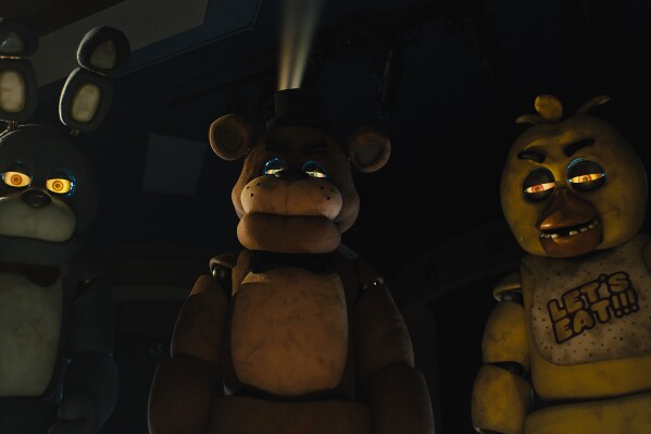 This image released by Universal Pictures shows, from left, Bonnie, Freddy Fazbear and Chica in a scene from 