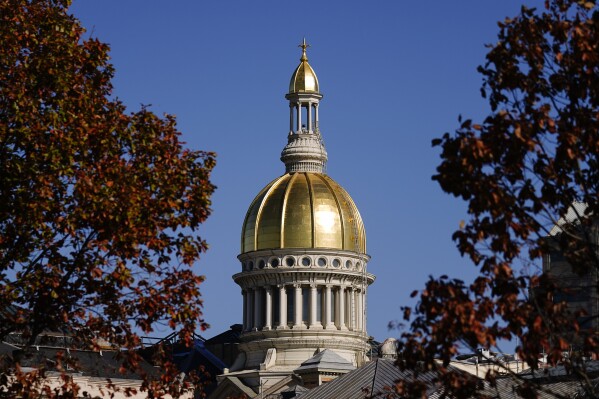 FILE - The New Jersey State House in Trenton, N.J., Wednesday, Nov. 10, 2021. New Jersey lawmakers were poised Monday to pass legislation that would boost their salaries from $49,000 a year to $82,000 annually, along with raises for the governor and other top officials in the state. (AP Photo/Matt Rourke, File)