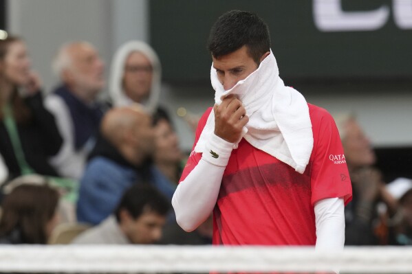 Serbia's Novak Djokovic reacts as he plays Mackenzie McDonald of the U.S. during their first round match of the French Tennis Open, at the Roland-Garros stadium, in Paris, Tuesday, May 27, 2025. (AP Photo/Christophe Ena)