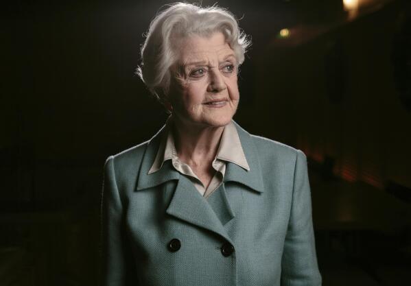 FILE - Angela Lansbury poses for a portrait during press day for "Blithe Spirit" in Los Angeles on Dec. 16, 2014. Lansbury, the big-eyed, scene-stealing British actress who kicked up her heels in the Broadway musicals “Mame” and “Gypsy” and solved endless murders as crime novelist Jessica Fletcher in the long-running TV series “Murder, She Wrote,” died peacefully at her home in Los Angeles on Tuesday. She was 96. (Photo by Casey Curry/Invision/AP, File)