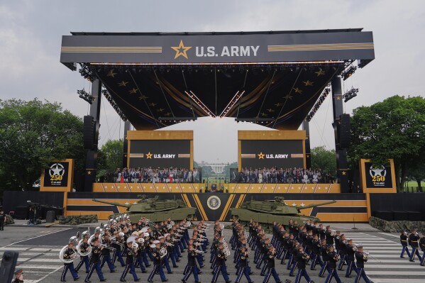 President Donald Trump attends a military parade commemorating the Army's 250th anniversary, coinciding with his 79th birthday, Saturday, June 14, 2025, in Washington. (AP Photo/Julia Demaree Nikhinson)