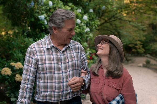 This image released by Netflix shows Tim Matheson, left, and Annette O'Toole in a scene from the series "Virgin River." (Netflix via AP)