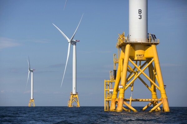 FILE - Three wind turbines from Deepwater Wind stand in the water off Block Island, R.I, the nation's first offshore wind farm, Aug. 15, 2016. The governors of Massachusetts, Rhode Island, and Connecticut announced a multi-state agreement Wednesday, Oct. 4, 2023, designed to streamline the selection of offshore wind energy projects. (AP Photo/Michael Dwyer, File)