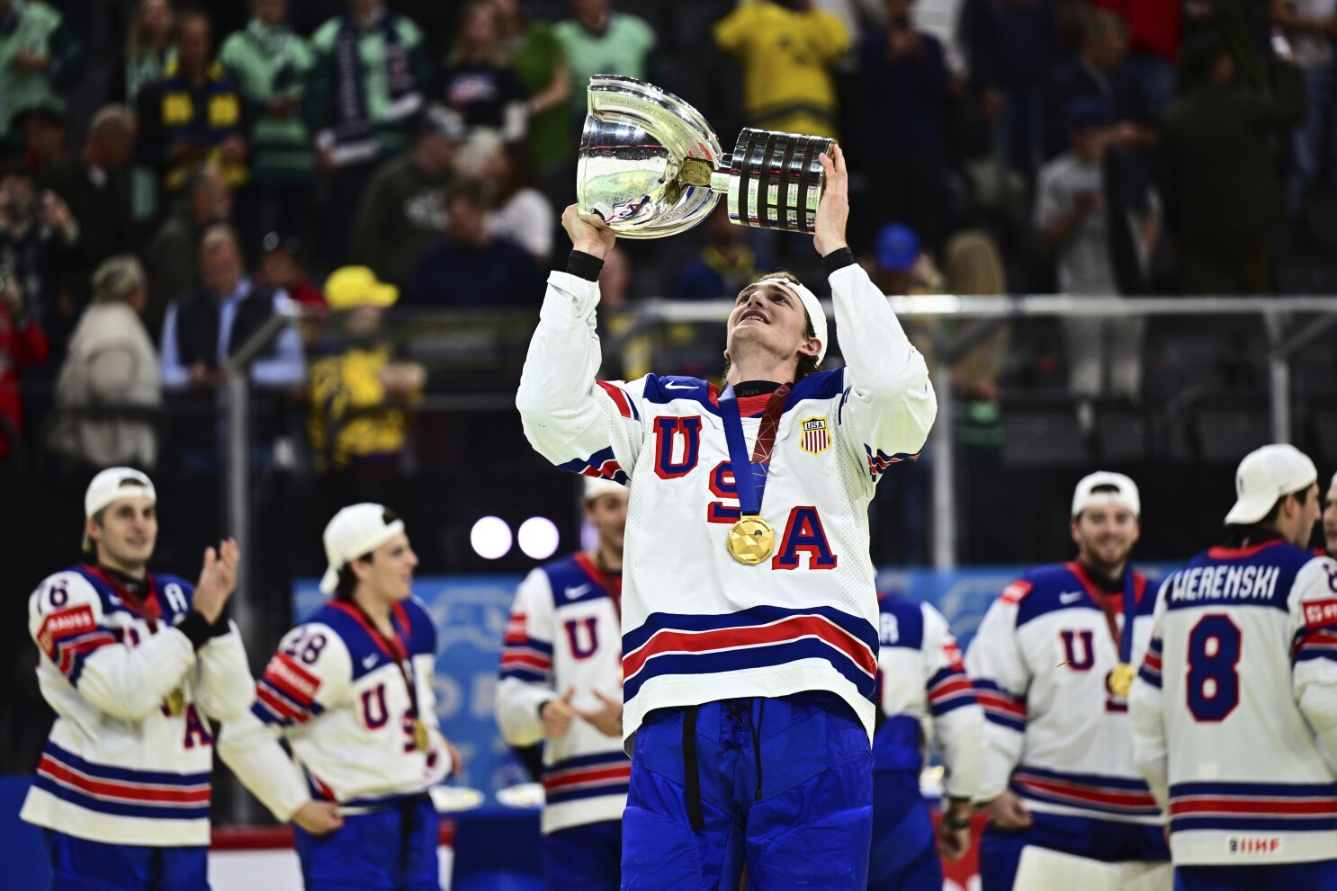 US wins 1st world hockey title since 1933 with 1-0 OT victory over Switzerland