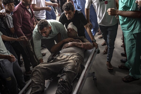A Palestinian wounded in Israeli bombardment of the Gaza Strip is brought to a hospital in Khan Younis, Sunday, Nov. 12, 2023. ( AP Photo/Fatima Shbair)