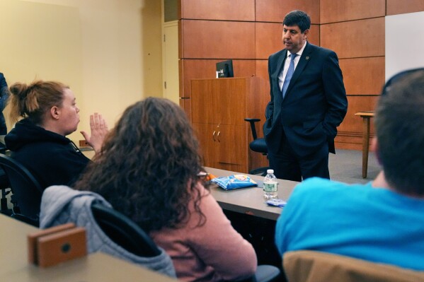 Steven Dettelbach, the Director of the Bureau of Alcohol, Tobacco and Firearms, talks with community members that were personally effected by the October 2023 mass shootings in Lewiston, Maine at Central Maine Community College, Thursday, Feb. 22, 2024, in Auburn, Maine. (AP Photo/Charles Krupa)