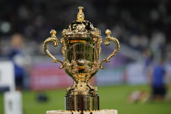 FILE - The Webb Ellis Cup, the championship trophy for the Rugby World Cup, is displayed on the field before the Rugby World Cup final at International Yokohama Stadium between England and South Africa in Yokohama, Japan, Saturday, Nov. 2, 2019. (AP Photo/Christophe Ena, File)