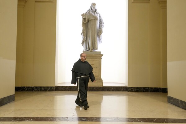 Head of the Italian committee on Artificial Intelligence (AI), Franciscan Friar Paolo Benanti who is also a consultant for The Vatican and discusses AI with Pope Francis arrives for an interview with the Associated Press in Rome, Monday, Jan. 15, 2024. (AP Photo/Gregorio Borgia)