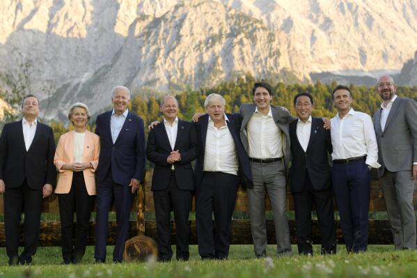 Group of Seven leaders pose during a group photo at the G7 summit at Castle Elmau in Kruen, near Garmisch-Partenkirchen, Germany, on Sunday, June 26, 2022. The Group of Seven leading economic powers are meeting in Germany for their annual gathering Sunday through Tuesday. From left, Italy's Prime Minister Mario Draghi, European Commission President Ursula von der Leyen, U.S. President Joe Biden, German Chancellor Olaf Scholz, British Prime Minister Boris Johnson, Canada's Prime Minister Justin Trudeau, Japan's Prime Minister Fumio Kishida, French President Emmanuel Macron and European Council President Charles Michel. (AP Photo/Markus Schreiber, Pool)
