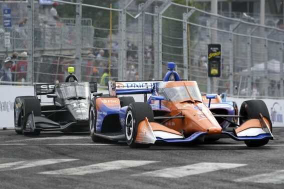 FILE - Scott Dixon (9) leads Kyle Kirkwood (14) through a turn during the Music City Grand Prix auto race Sunday, Aug. 7, 2022, in Nashville, Tenn. IndyCar loves racing through the streets of Music City so much that the series is making Nashville the final race of the season and the stage for its annual awards starting in 2024. Mark Miles, president and CEO of Penske Entertainment Corp., announced Thursday, Aug. 3, 2023 that the combination of Nashville and the Big Machine Music City Grand Prix will help elevate the IndyCar Series even higher globally. (AP Photo/Mark Humphrey, File)