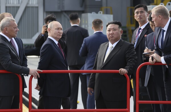 Russian President Vladimir Putin and North Korea's leader Kim Jong Un examine a launch pad during their meeting at the Vostochny cosmodrome outside the city of Tsiolkovsky, about 200 kilometers (125 miles) from the city of Blagoveshchensk in the far eastern Amur region, Russia, on Wednesday, Sept. 13, 2023. (Mikhail Metzel, Sputnik, Kremlin Pool Photo via AP)