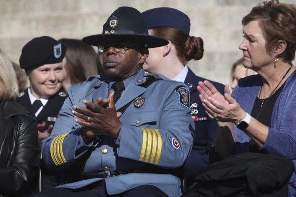 Kansas Highway Patrol Superintendent Herman Jones, in uniform, responds to introductions of other state officials during the inauguration for Gov. Laura Kelly's second term, Monday, Jan. 9, 2023, outside the Kansas Statehouse in Topeka, Kan. Jones is retiring from the patrol and Kelly has named a high-ranking U.S. Drug Administration official to replace him. (AP Photo/John Hanna)